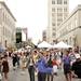 Taylor Tinkham (center) does The Hustle with many others on Washington St. in Ann Arbor on Sunday. Tinkham says she came downtown to do work when she found the festival and decided to join in. Daniel Brenner I AnnArbor.com